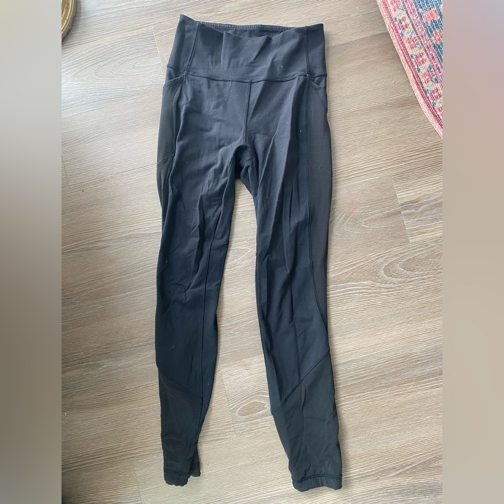 Black leggings with mesh detail. Size 6